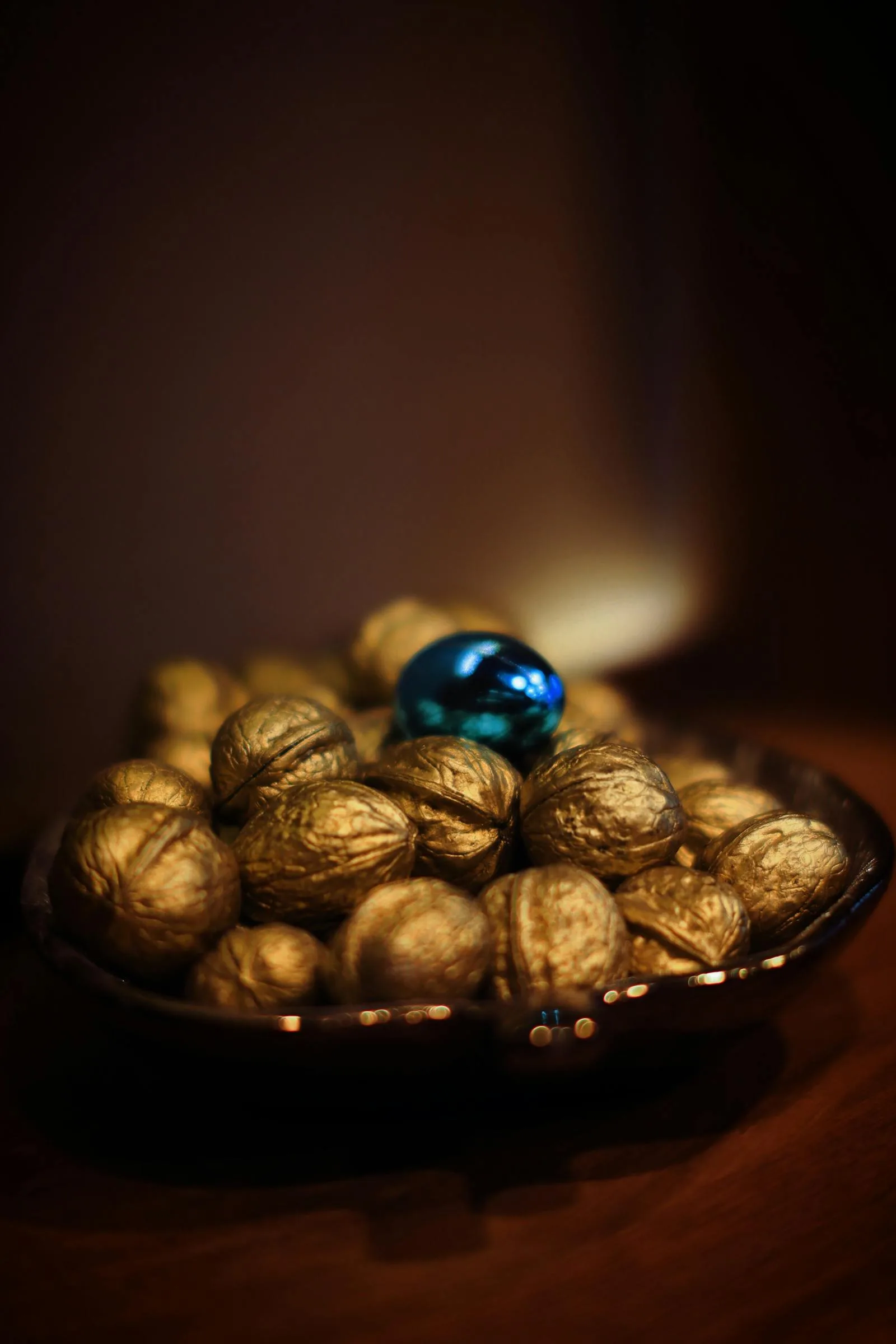 Soft gold decorative bowl with warm metallic tones used as a small abundance accent