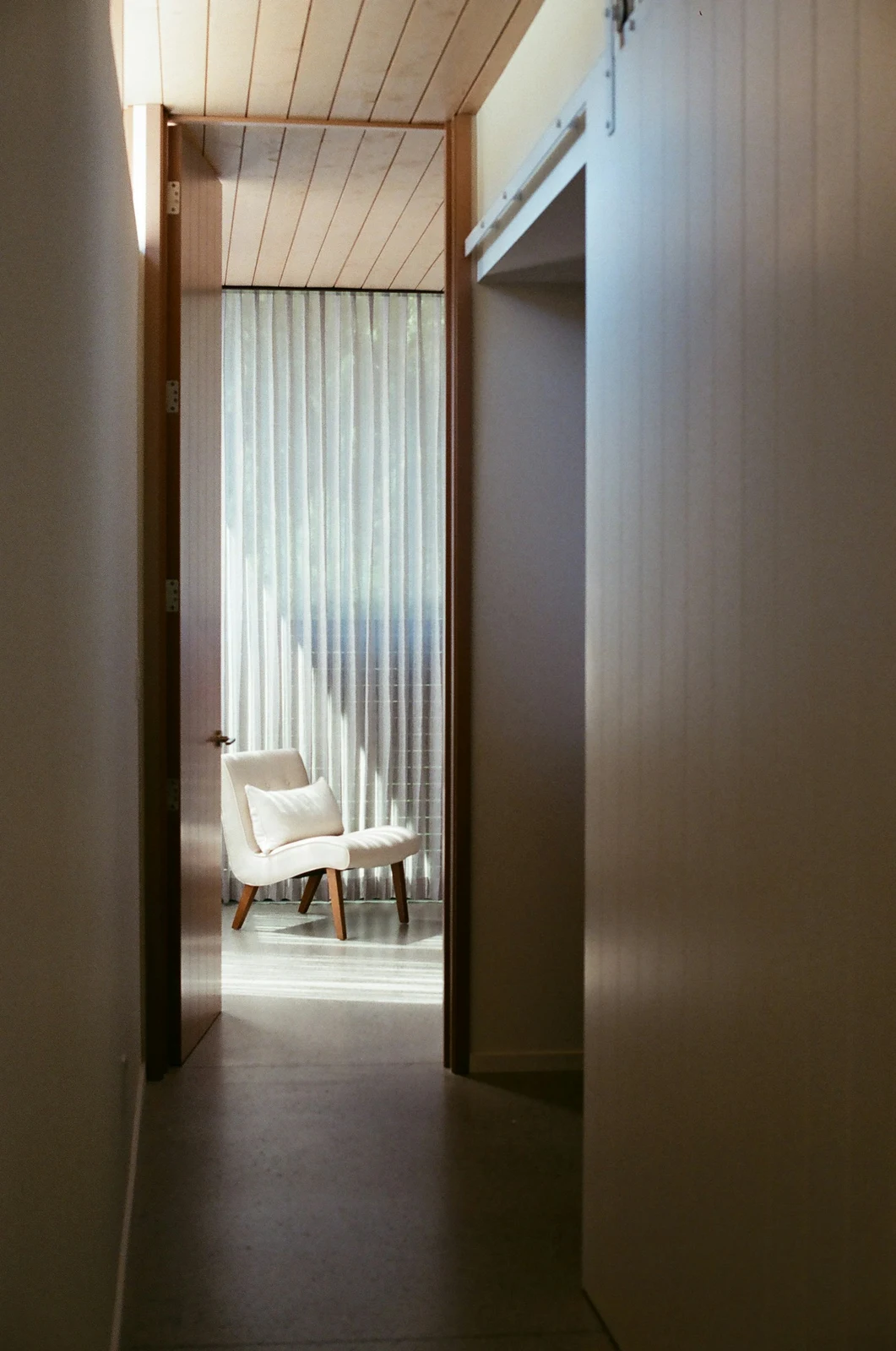 Modern hallway with natural light at the end