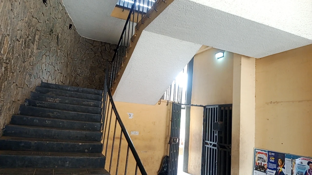 Staircase landing with railings and visible route
