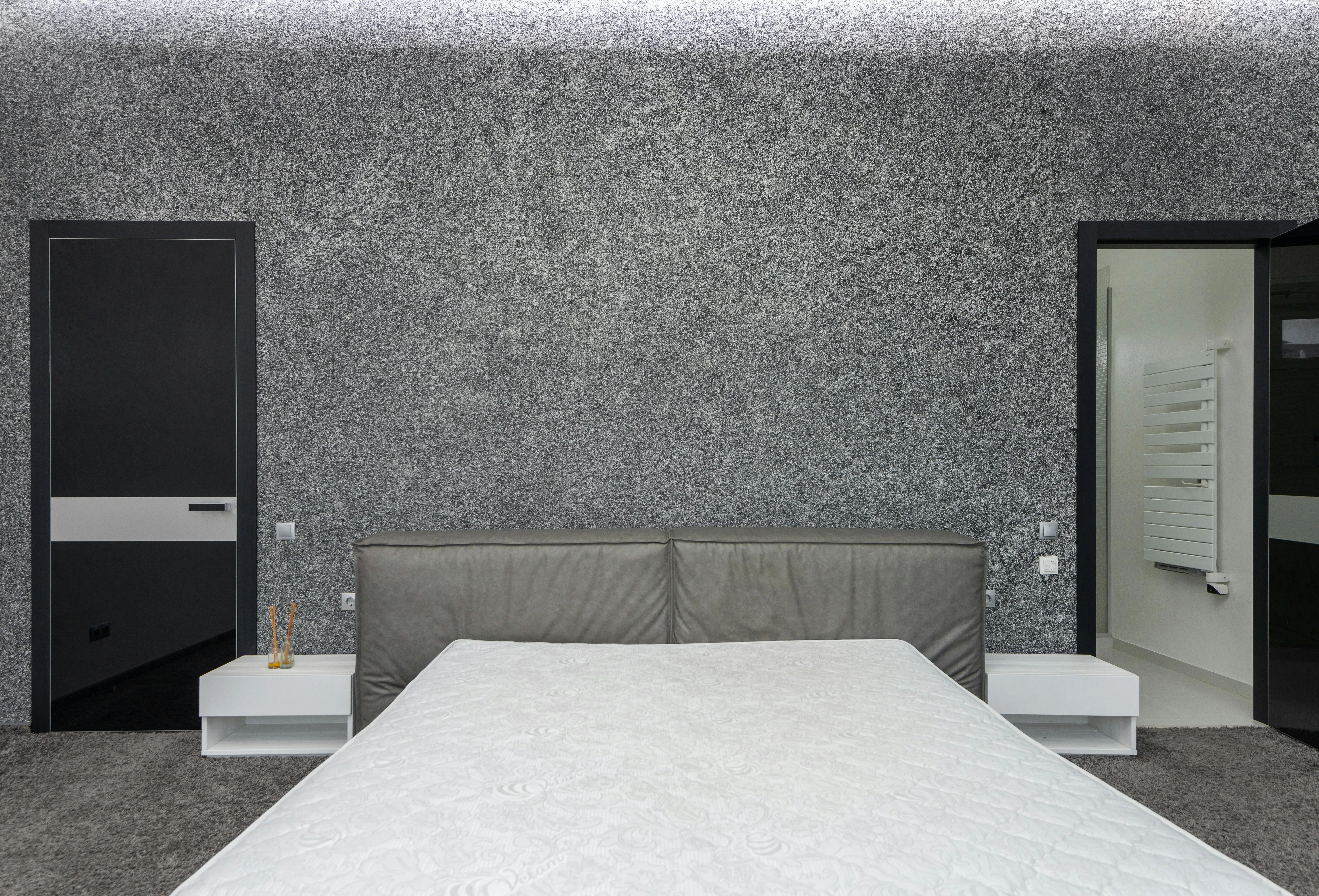 Bedroom where the bed still holds the strongest wall while the rest of the openings stay secondary