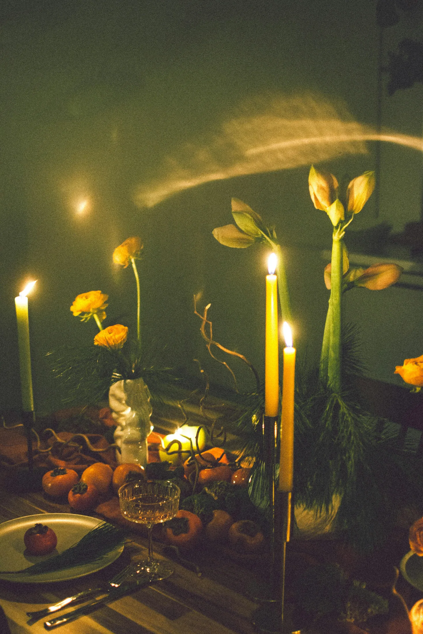 Candlelit table with warm flowers and soft evening light