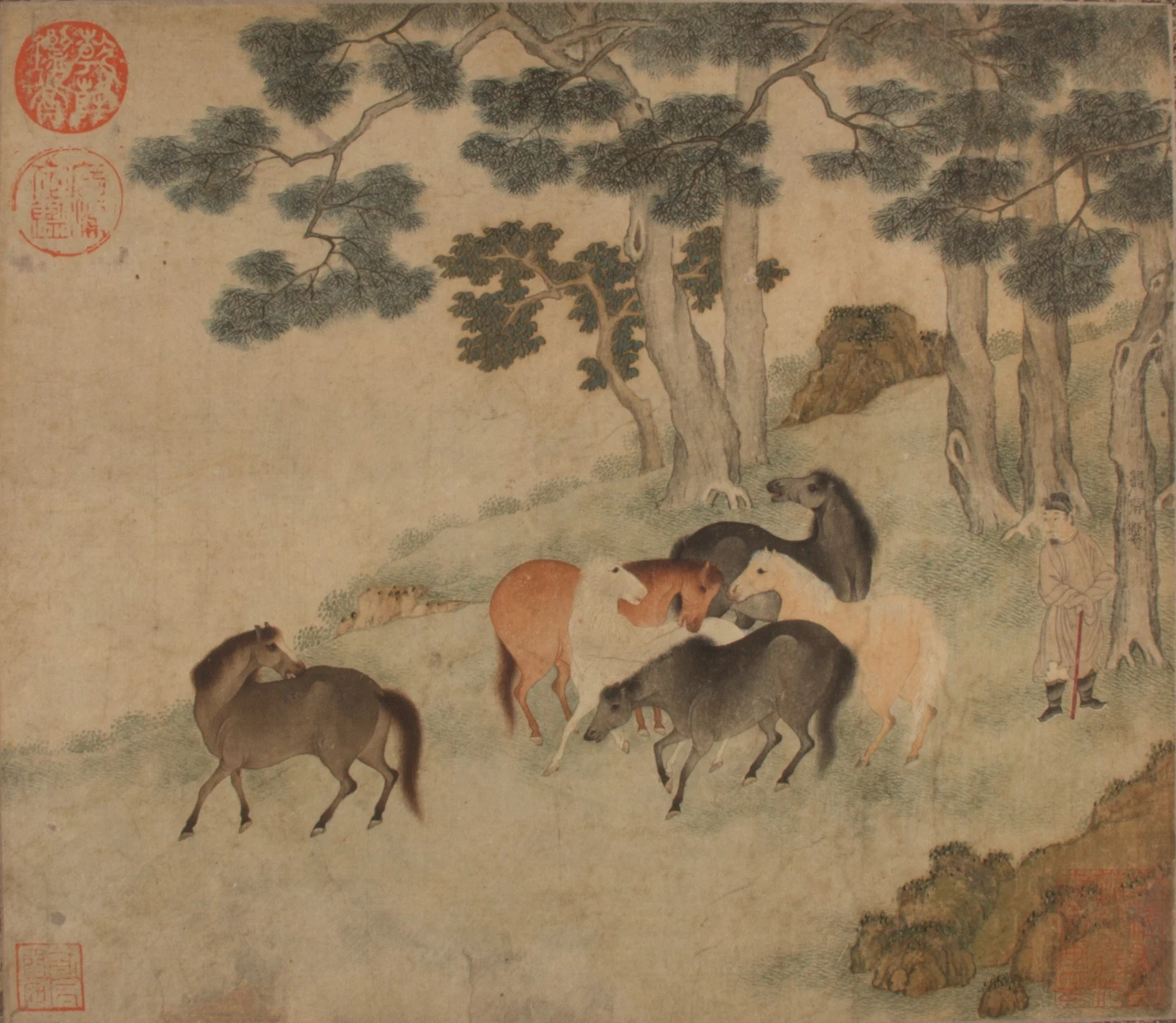 Chinese painting of horses gathered beneath pine trees beside an attendant