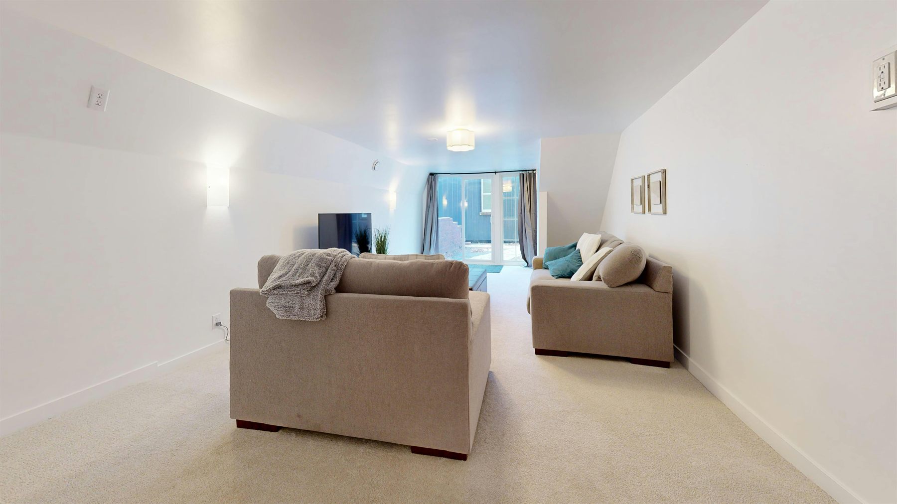 Long small apartment-like room with clear zones, calm color, and an easier furniture flow