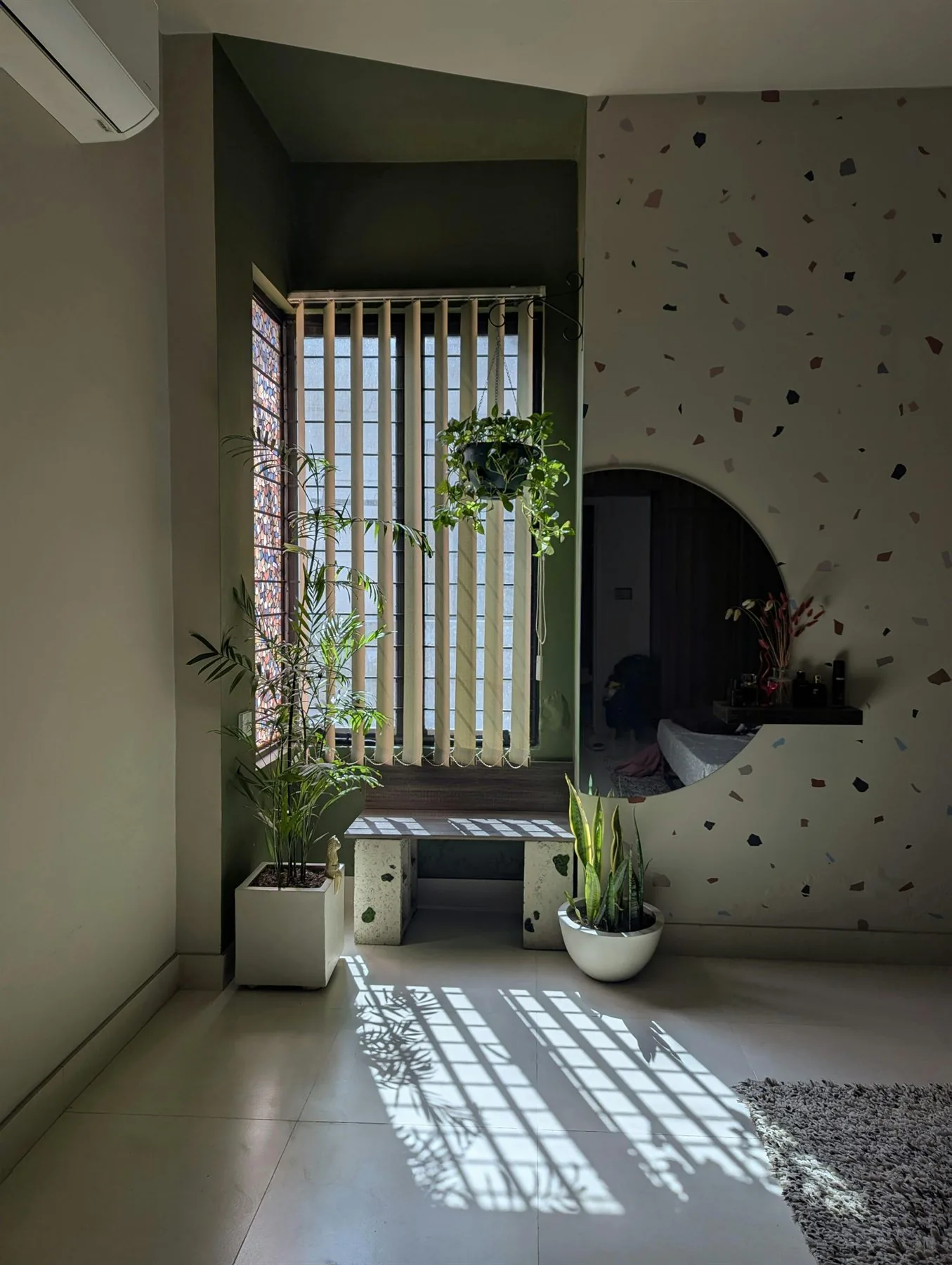 Calm interior with shelving, soft decor, and warm natural light