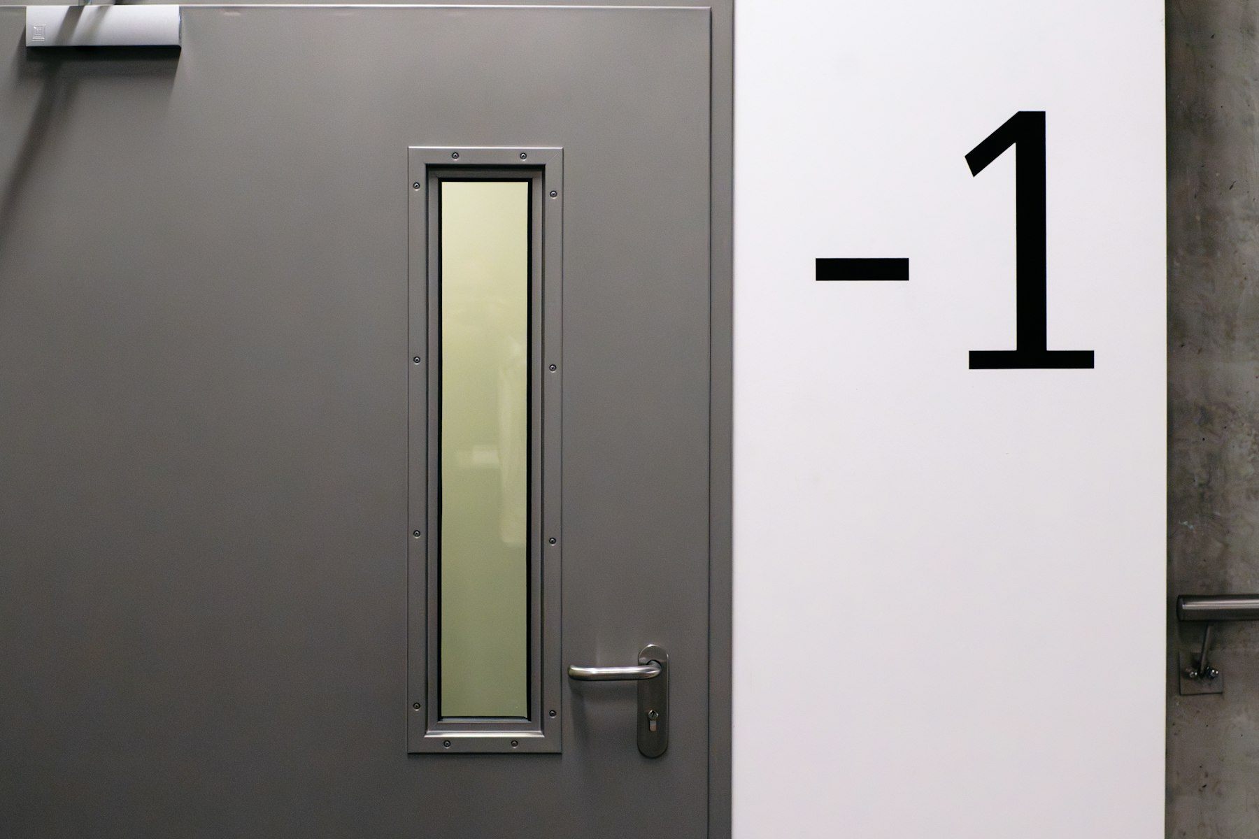 Front door with a clean number marker and a simple welcoming threshold