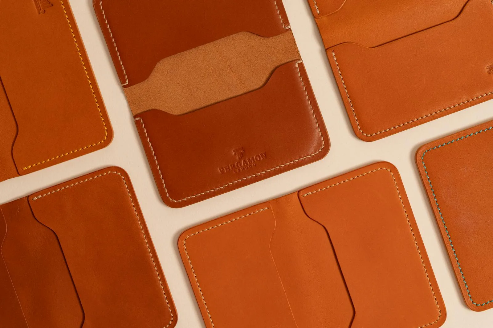 Lineup of brown leather wallets in warm tan and cognac shades