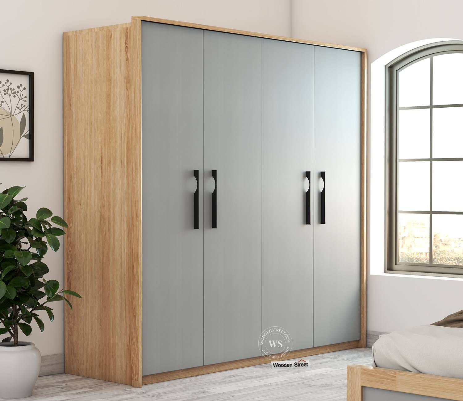 Oak-framed wardrobe with calm gray doors beside a bed and window