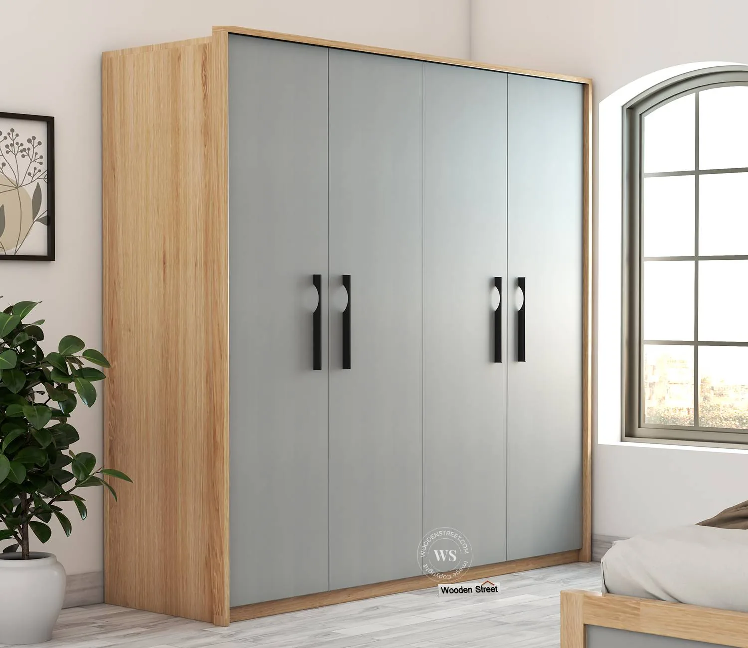 Oak-framed wardrobe with calm gray doors beside a bed and window