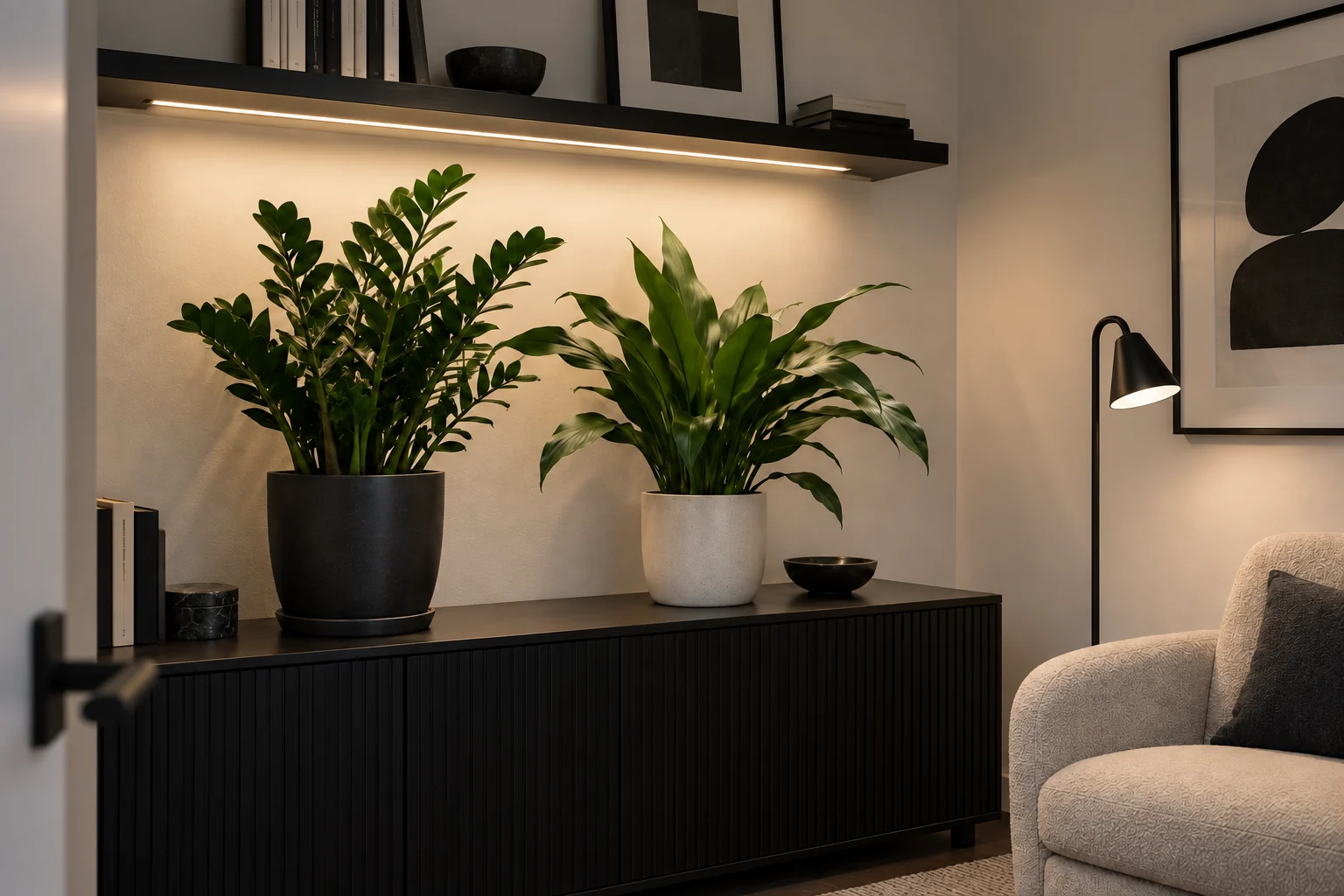 ZZ plant and cast iron plant beneath an integrated grow light in a windowless reading room